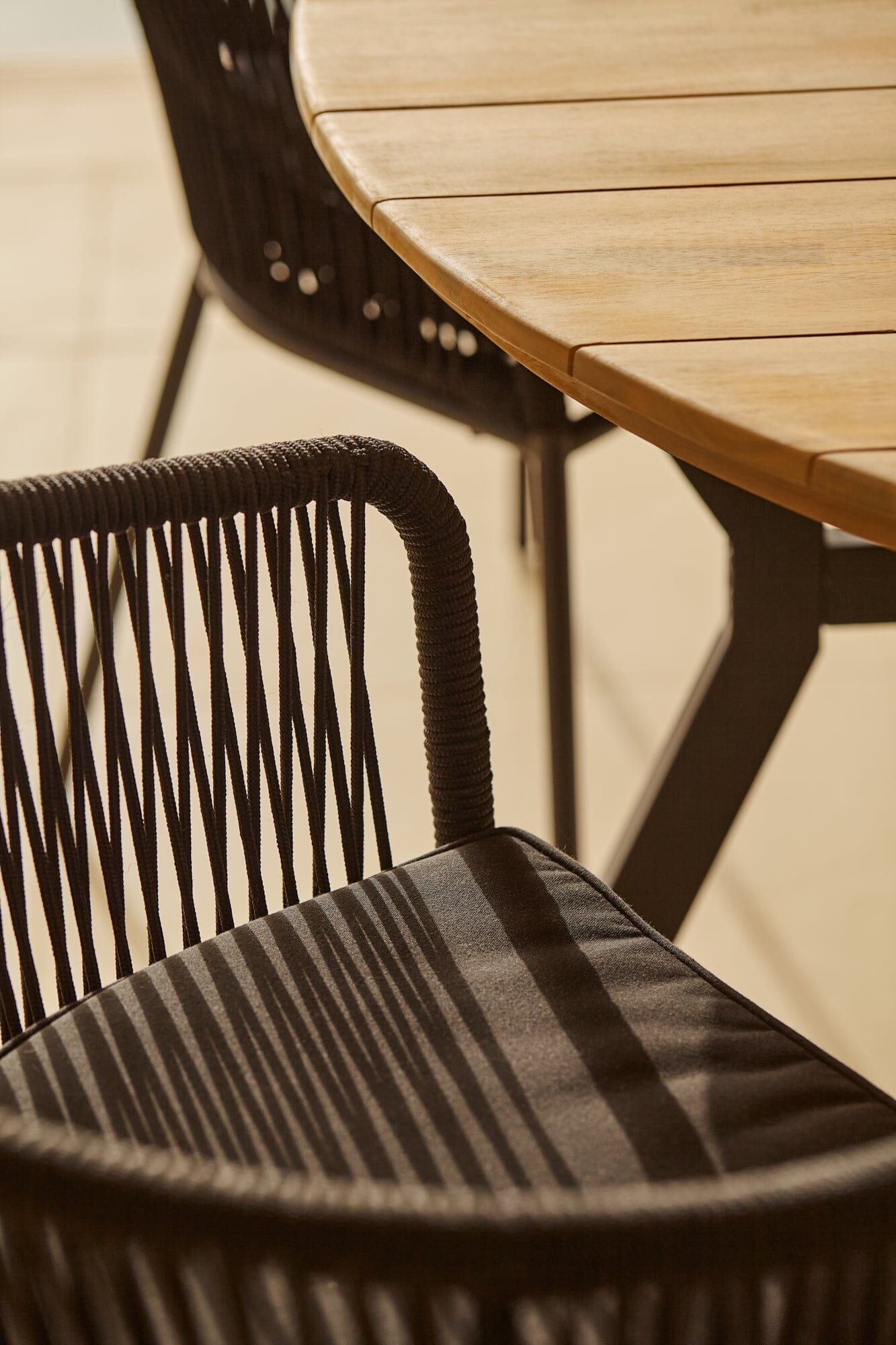 Ezra Whitewash Round Outdoor Dining Table Set with Black Hali Rope Chairs - Laura James