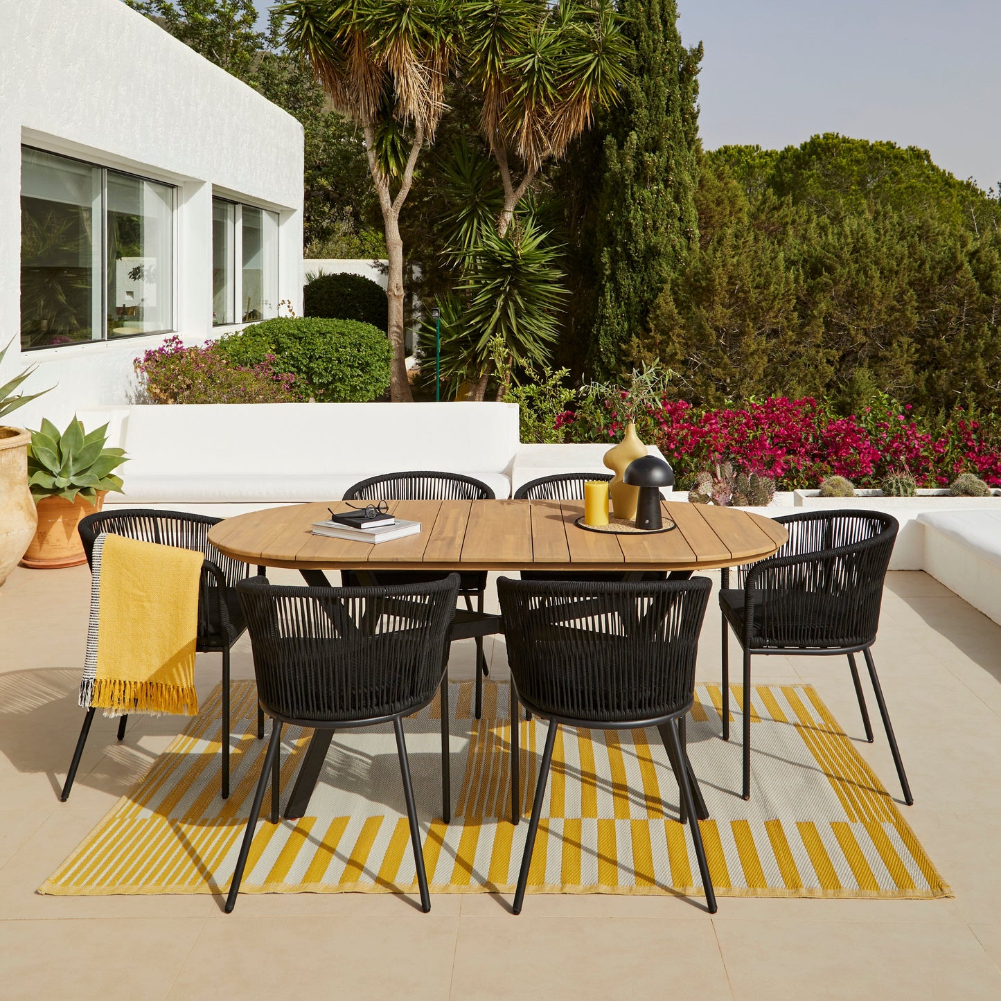 Ezra 6 Seater Oval Wooden Garden Dining Set with 6 Hali Black Rope Chairs - Laura James