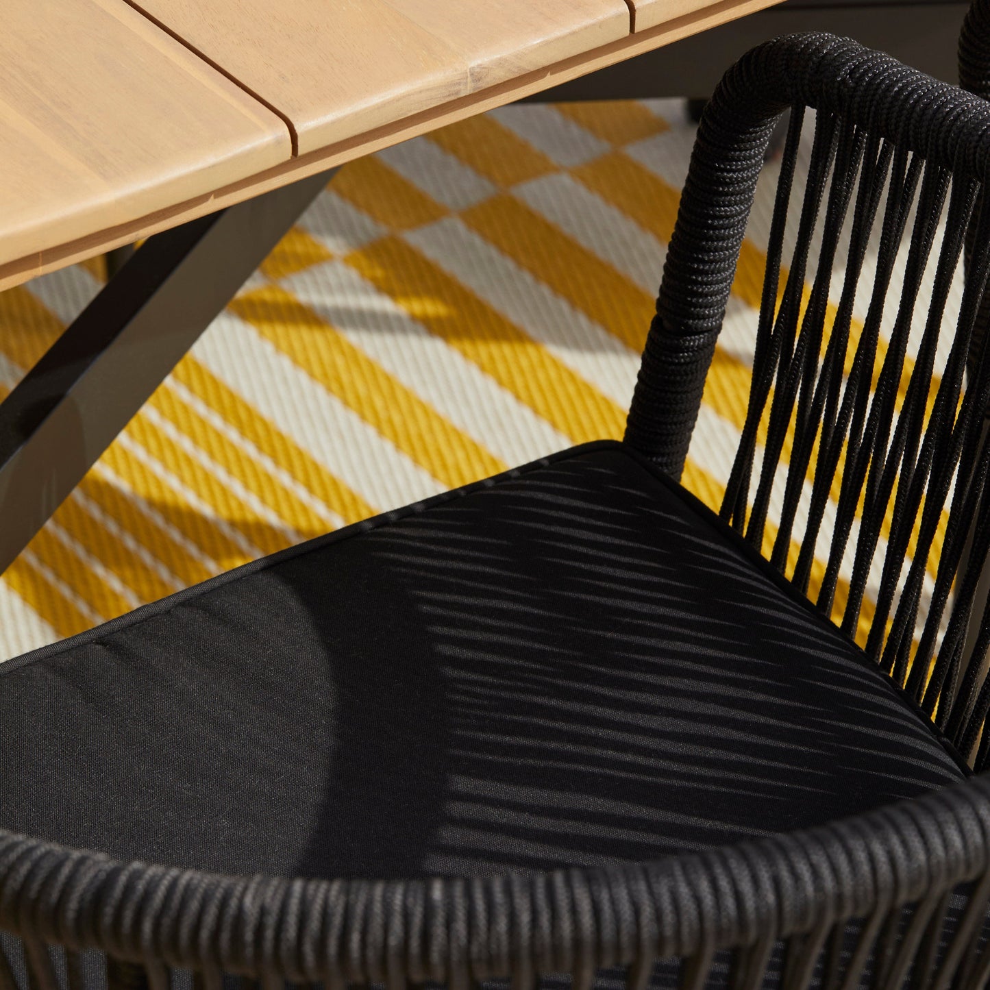 Ezra 6 Seater Oval Wooden Garden Dining Set with 6 Hali Black Rope Chairs - Laura James