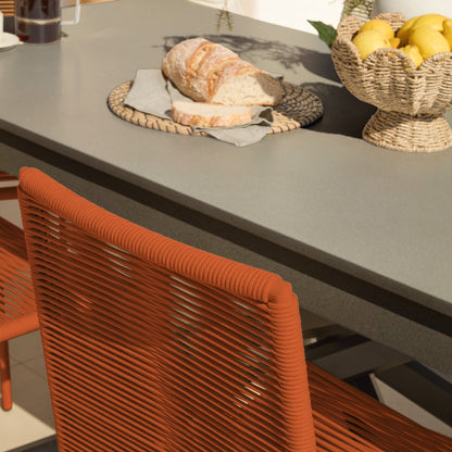 Amelia 6 Seater Dove Grey Concrete Garden Dining Set with Ryder Burnt Orange Chairs - Laura James